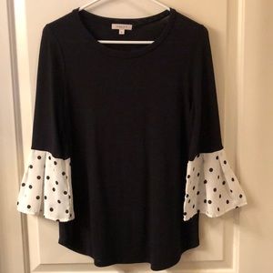 Black blouse with circular flounce sleeve